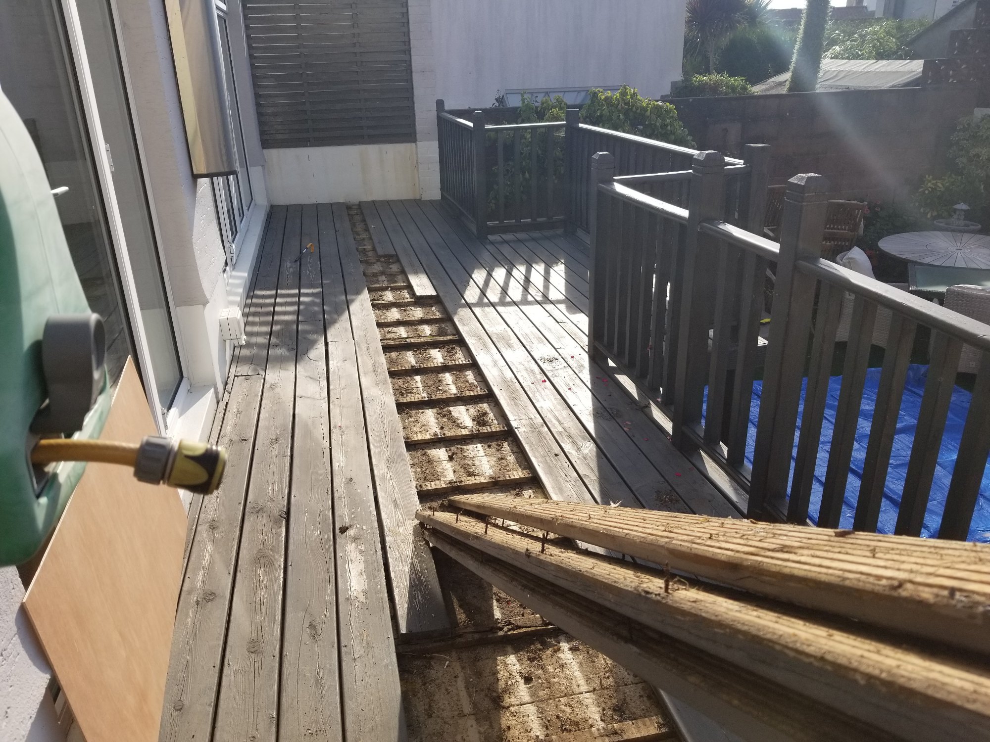 The renovation began with the careful removal of the old and weathered timber deck boards.