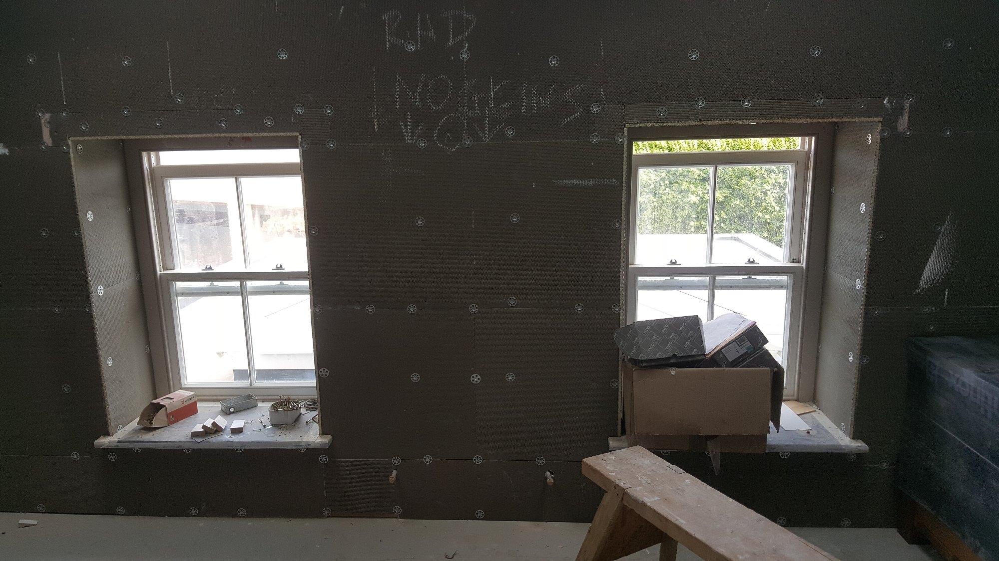The prepared wall surfaces and window reveals were ready for waterproofing, tiling and final finishing work.