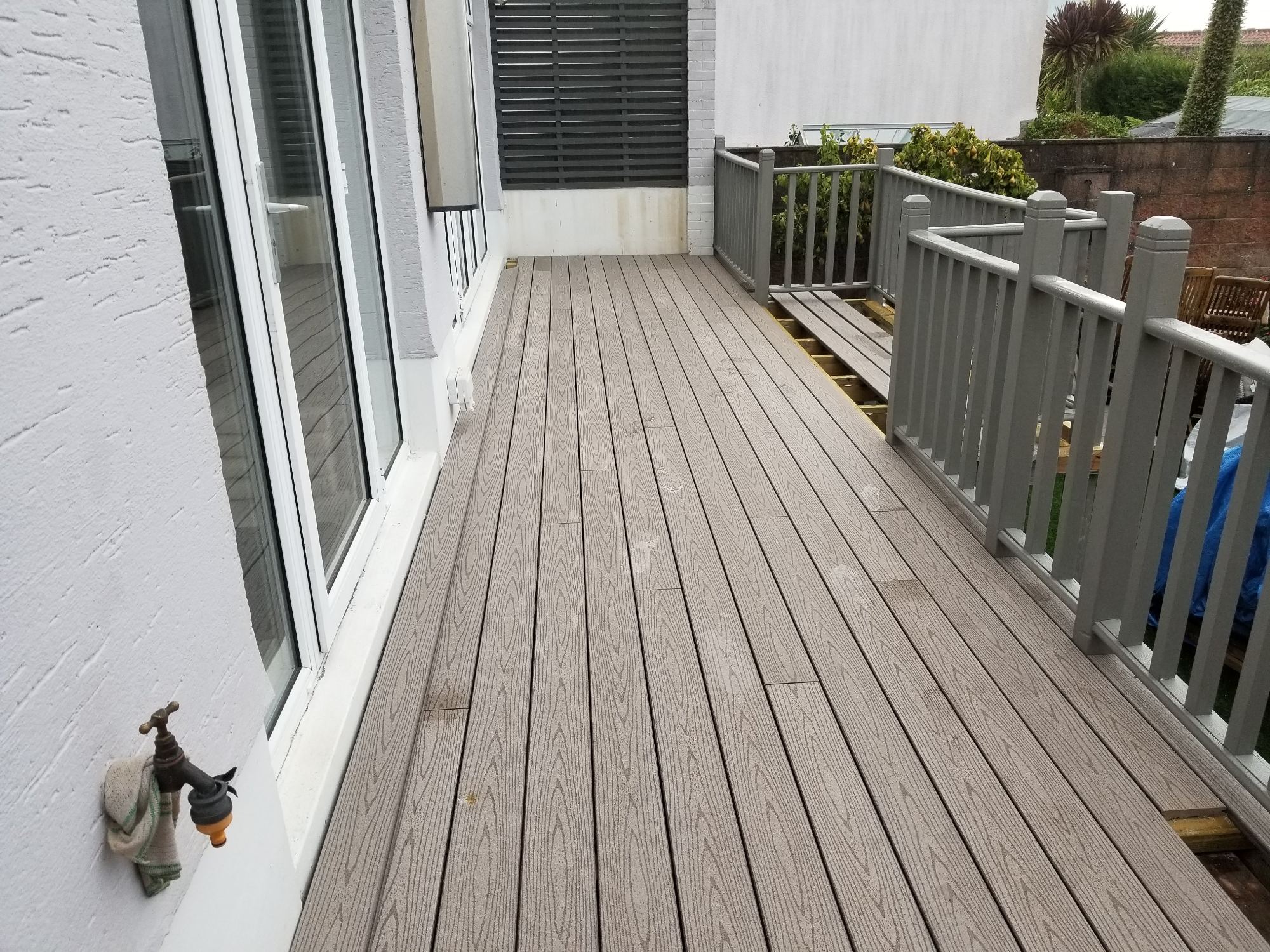 New decking nearing completion The main deck area was covered with durable composite boards, creating an even and attractive surface.