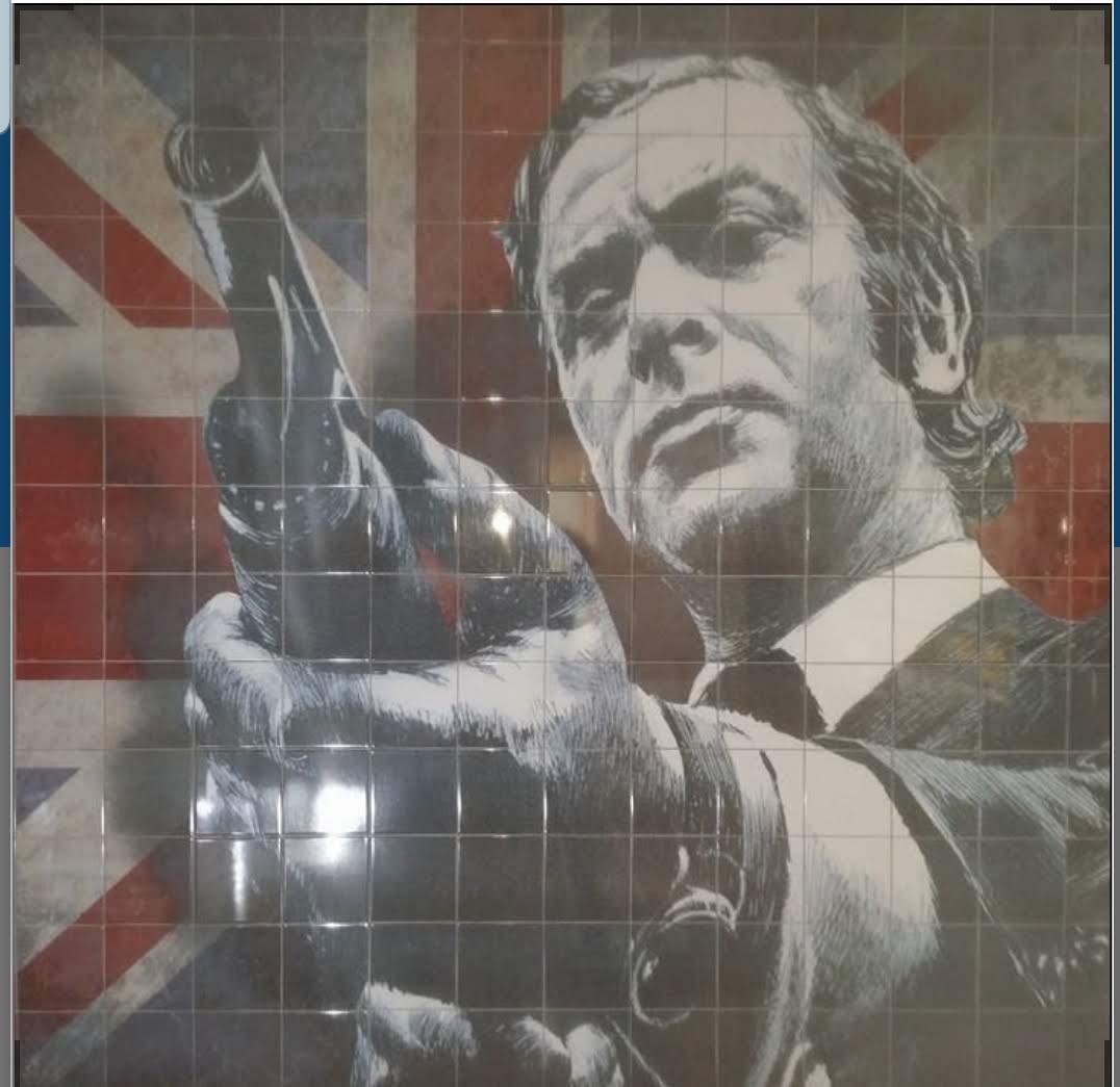 Decorative tiled wall mural with a portrait of a man and a Union Jack background.